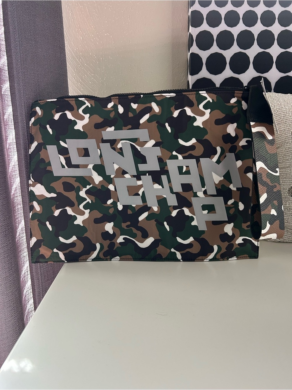 Longchamp Camo Print Clutch with Reflective Logo.